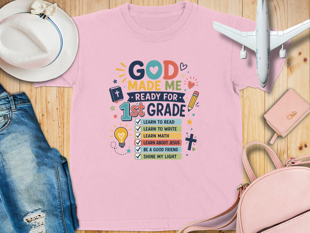 Pink t-shirt with "God Made Me Ready for 1st Grade" and a checklist.