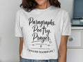 White t-shirt with "Paragraphs. Poetry. Prayer. English Teacher Life" text.