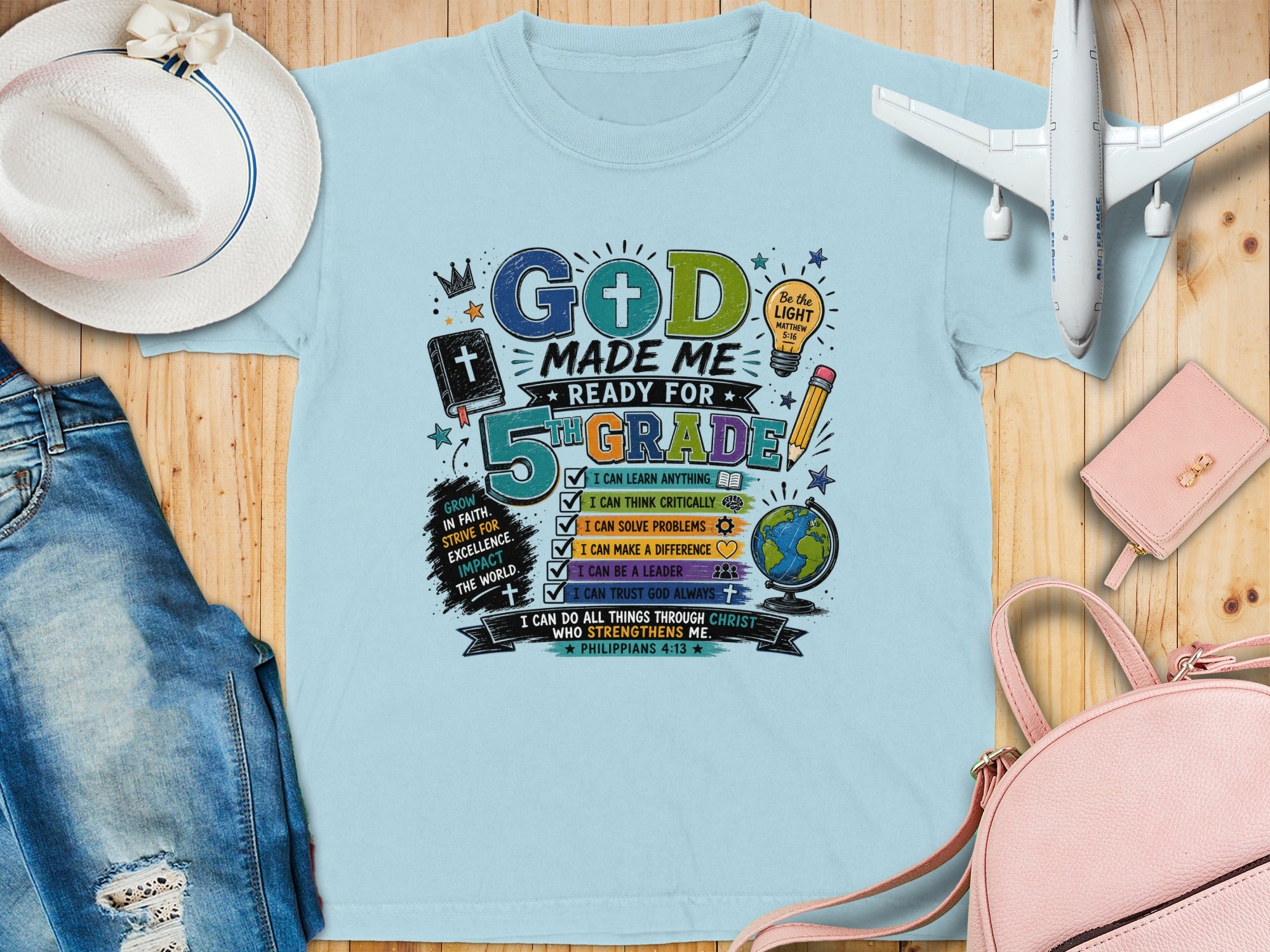 "God Made Me Ready for 5th Grade" graphic tee with Bible verses.