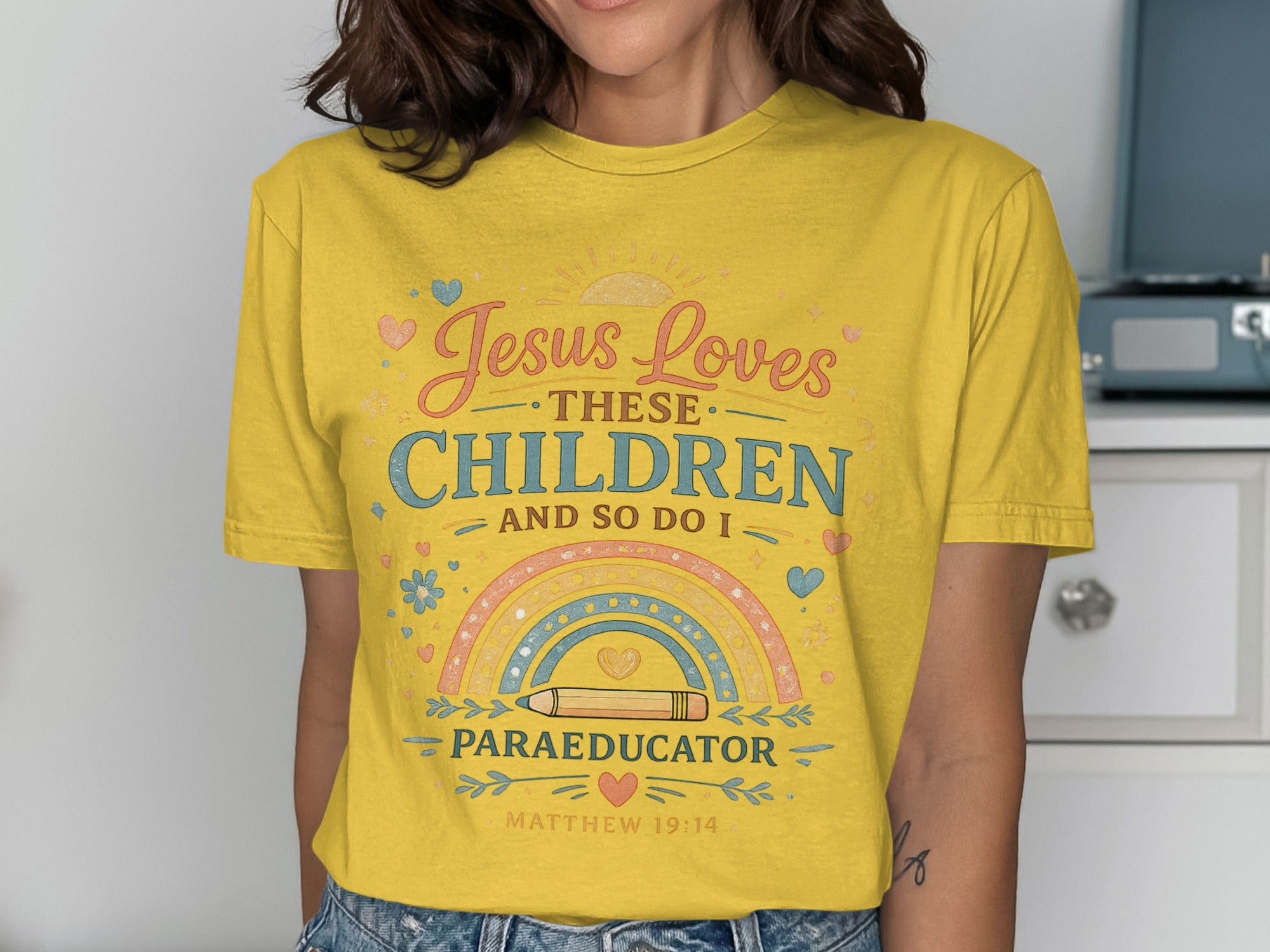 Yellow t-shirt with "Jesus Loves These Children And So Do I" and "Paraeducator" text.