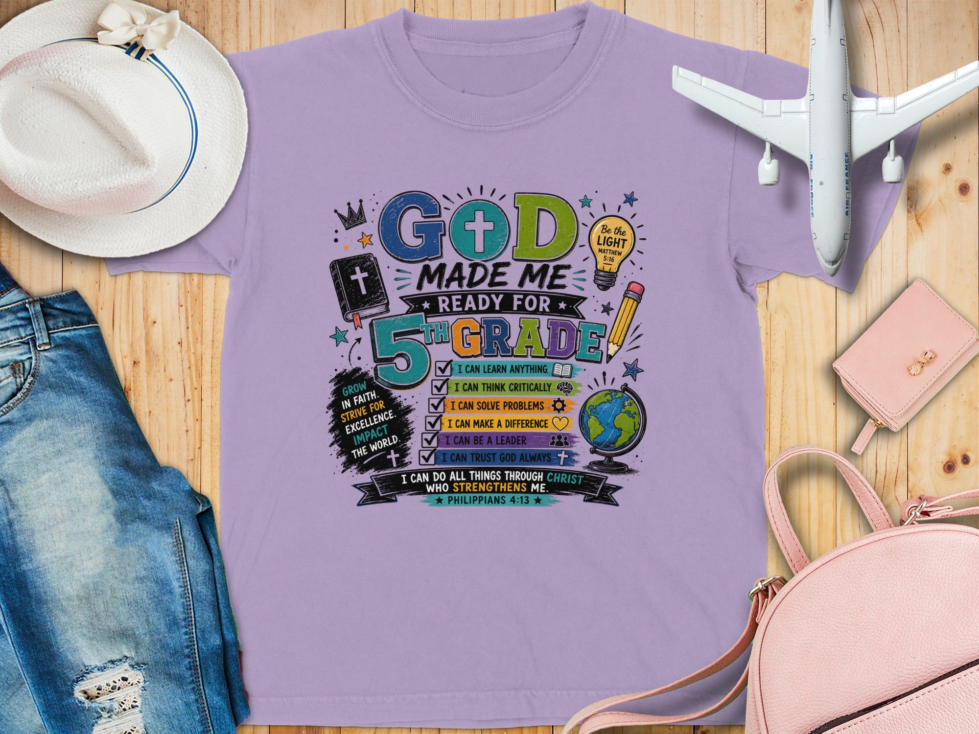 Purple t-shirt with "God Made Me Ready for 5th Grade" text and affirmations.