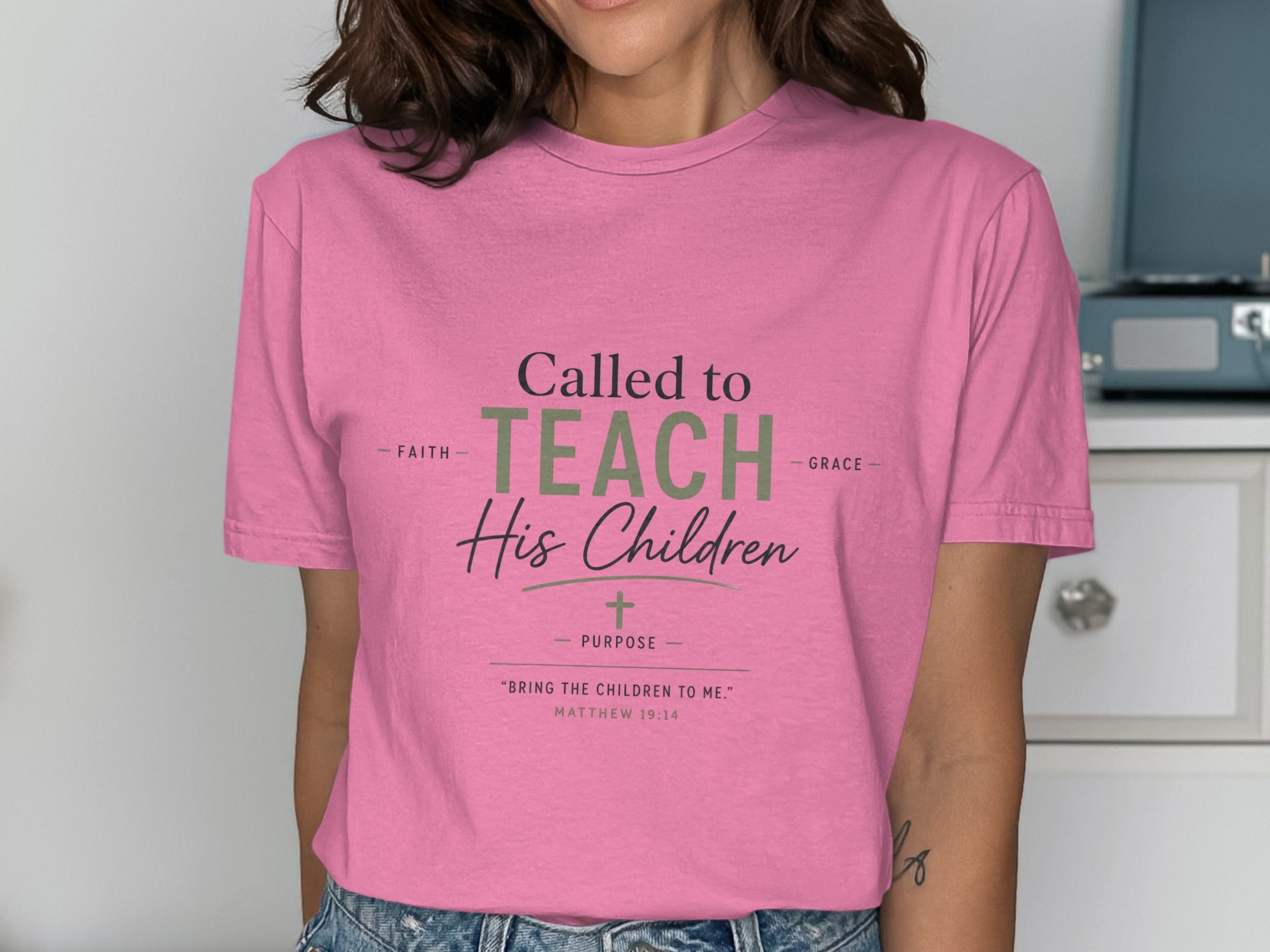 Pink t-shirt with "Called to Teach His Children" and Matthew 19:14.