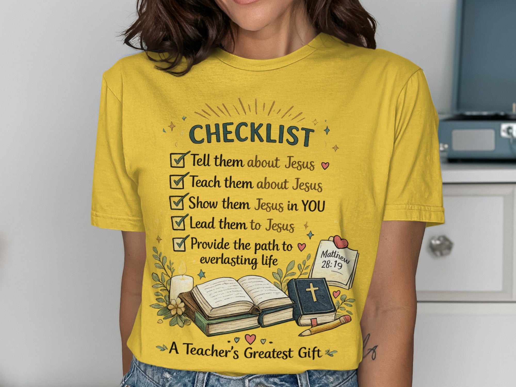 Yellow t-shirt with a checklist about Jesus and "A Teacher's Greatest Gift".