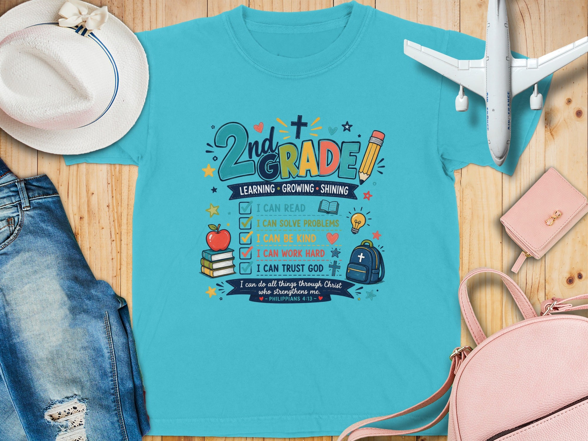 Blue t-shirt with "2nd Grade Learning Growing Shining" and Bible verse.