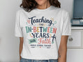 T-shirt with "Teaching the In-Between Years with Faith Middle School Teacher" text.