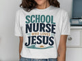 White t-shirt with "SCHOOL NURSE WHO LOVES JESUS" in blue and green lettering.