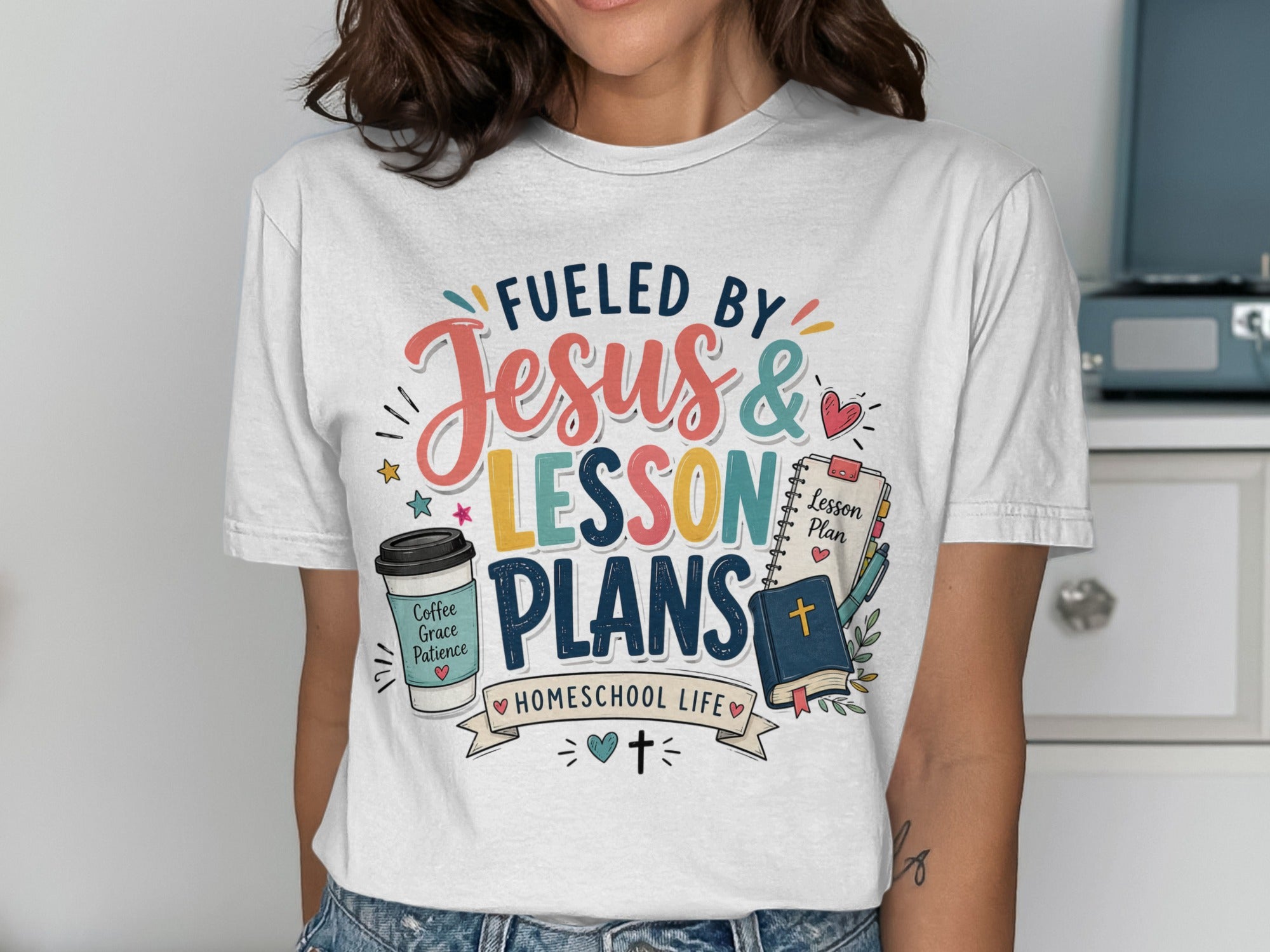 T-shirt with "Fueled by Jesus & Lesson Plans" in colorful text.