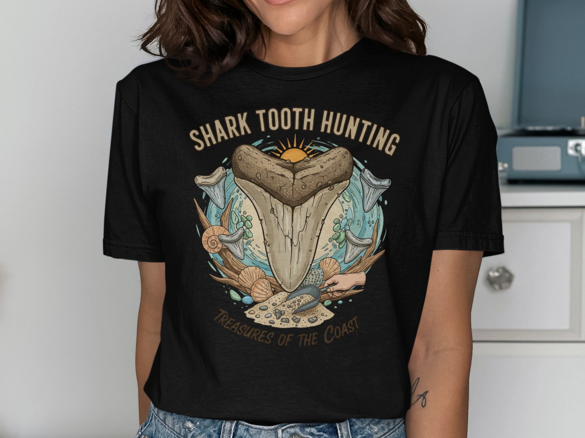 Black t-shirt with "Shark Tooth Hunting" and "Treasures of the Coast" graphic.