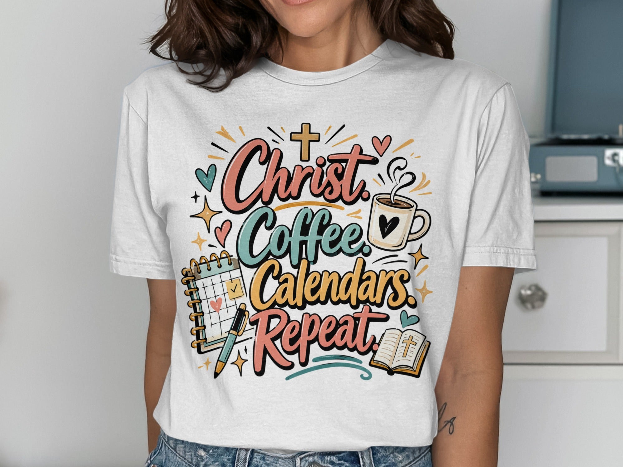 T-shirt with "Christ Coffee Calendars Repeat" graphic and religious symbols.
