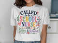 White t-shirt with "Called to be a School Nurse with Grace & Wisdom" slogan and medical graphics.