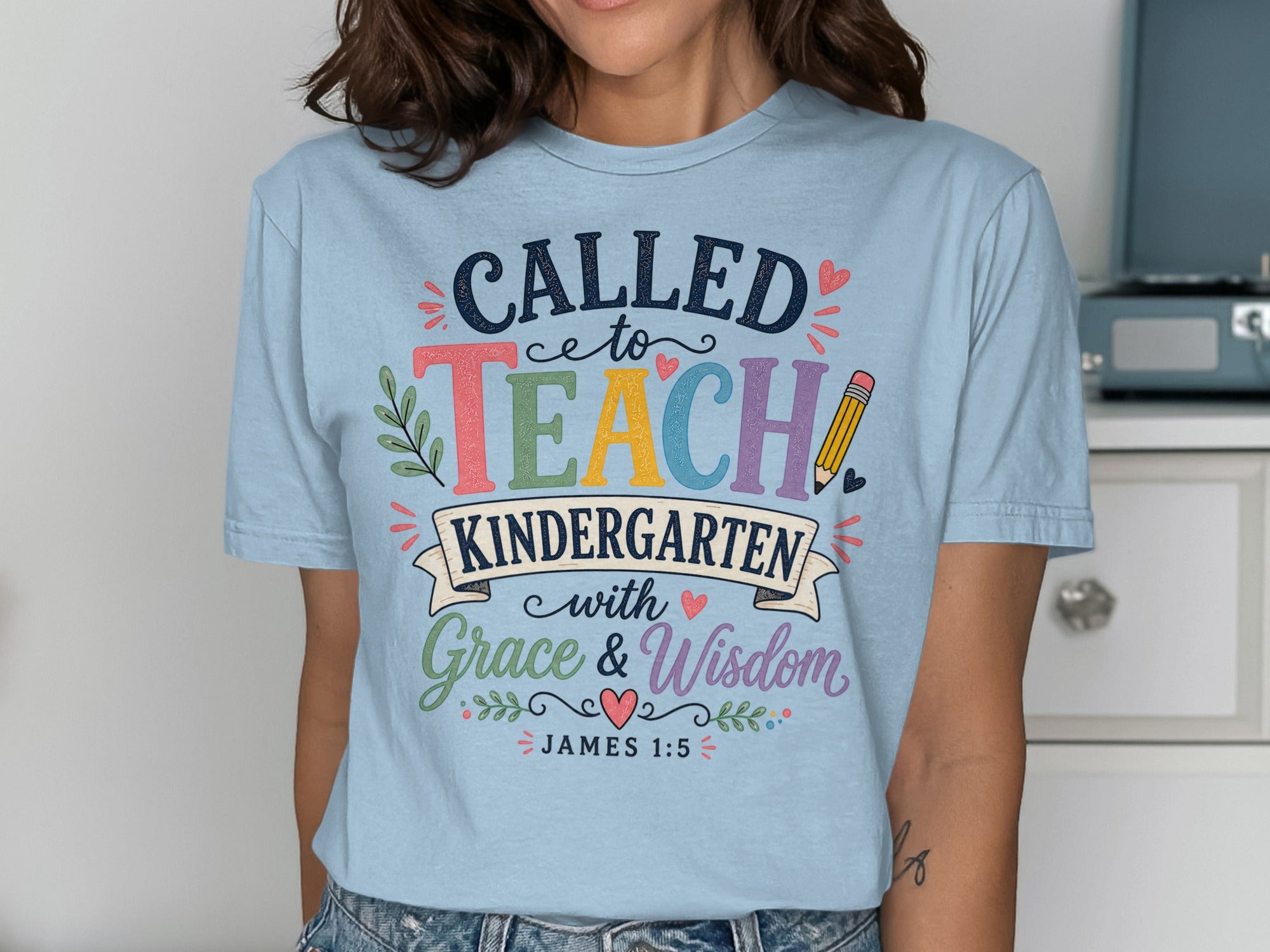 Light blue t-shirt with "Called to Teach Kindergarten with Grace & Wisdom" text.