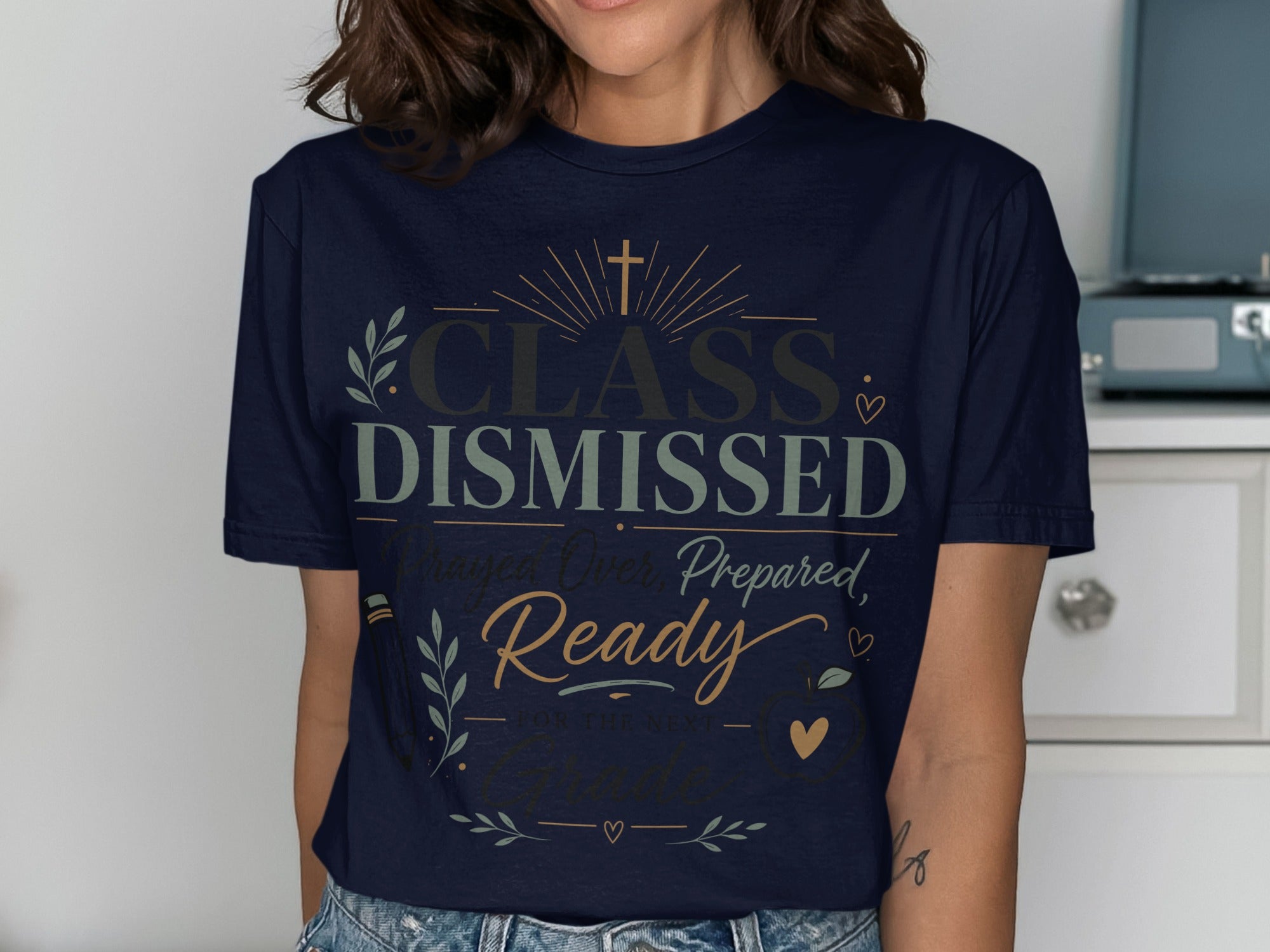 Navy t-shirt with "Class Dismissed" in gold and green text.