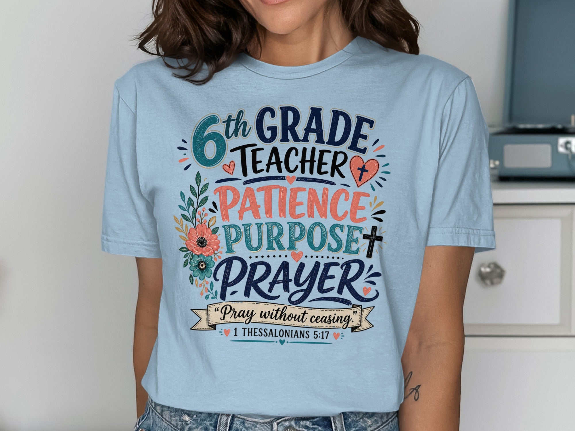 Light blue t-shirt with "6th GRADE TEACHER PATIENCE PURPOSE PRAYER" and Bible verse.
