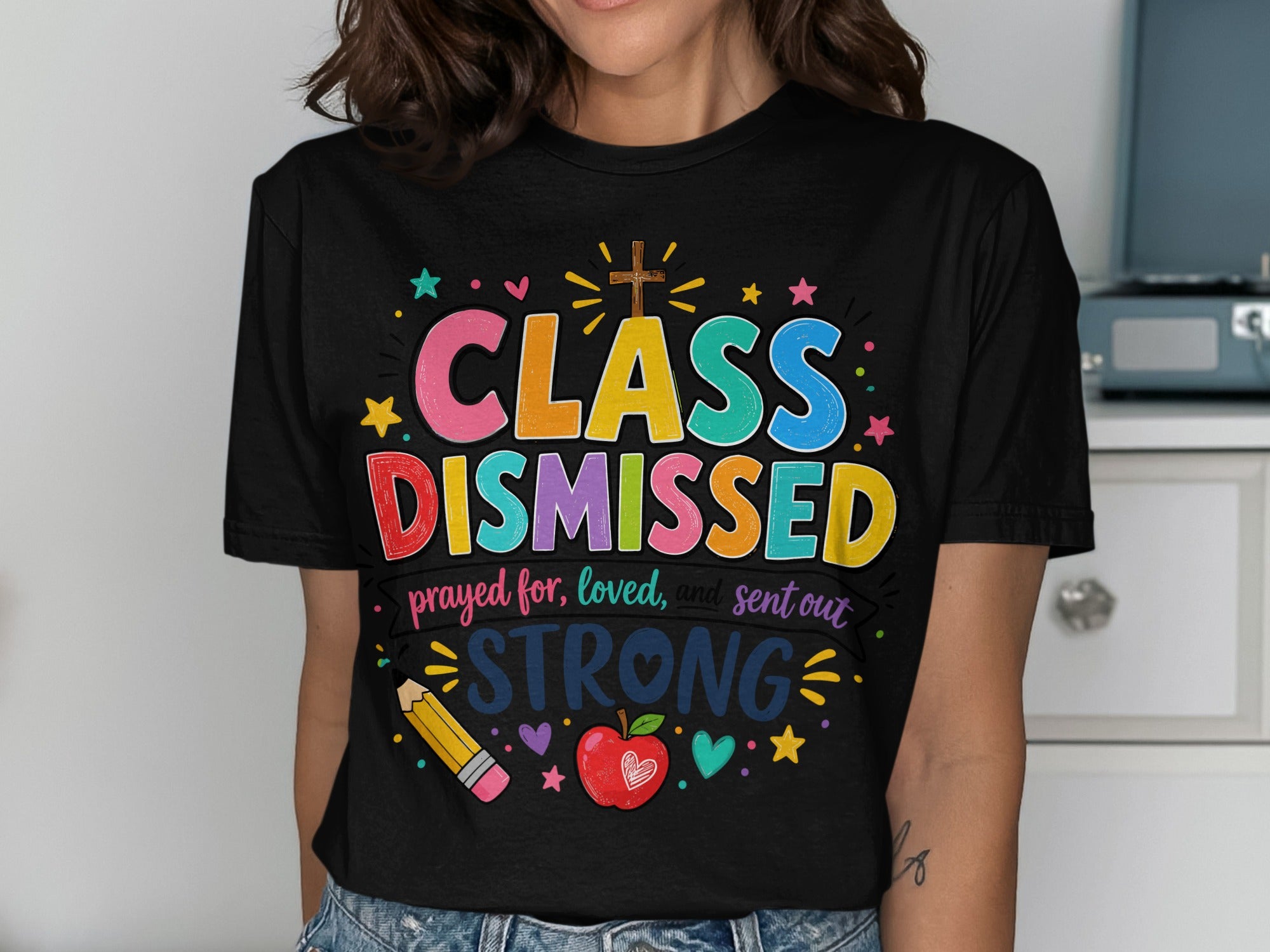 Black t-shirt with "CLASS DISMISSED" and "prayed for, loved, and sent out STRONG" in colorful text.