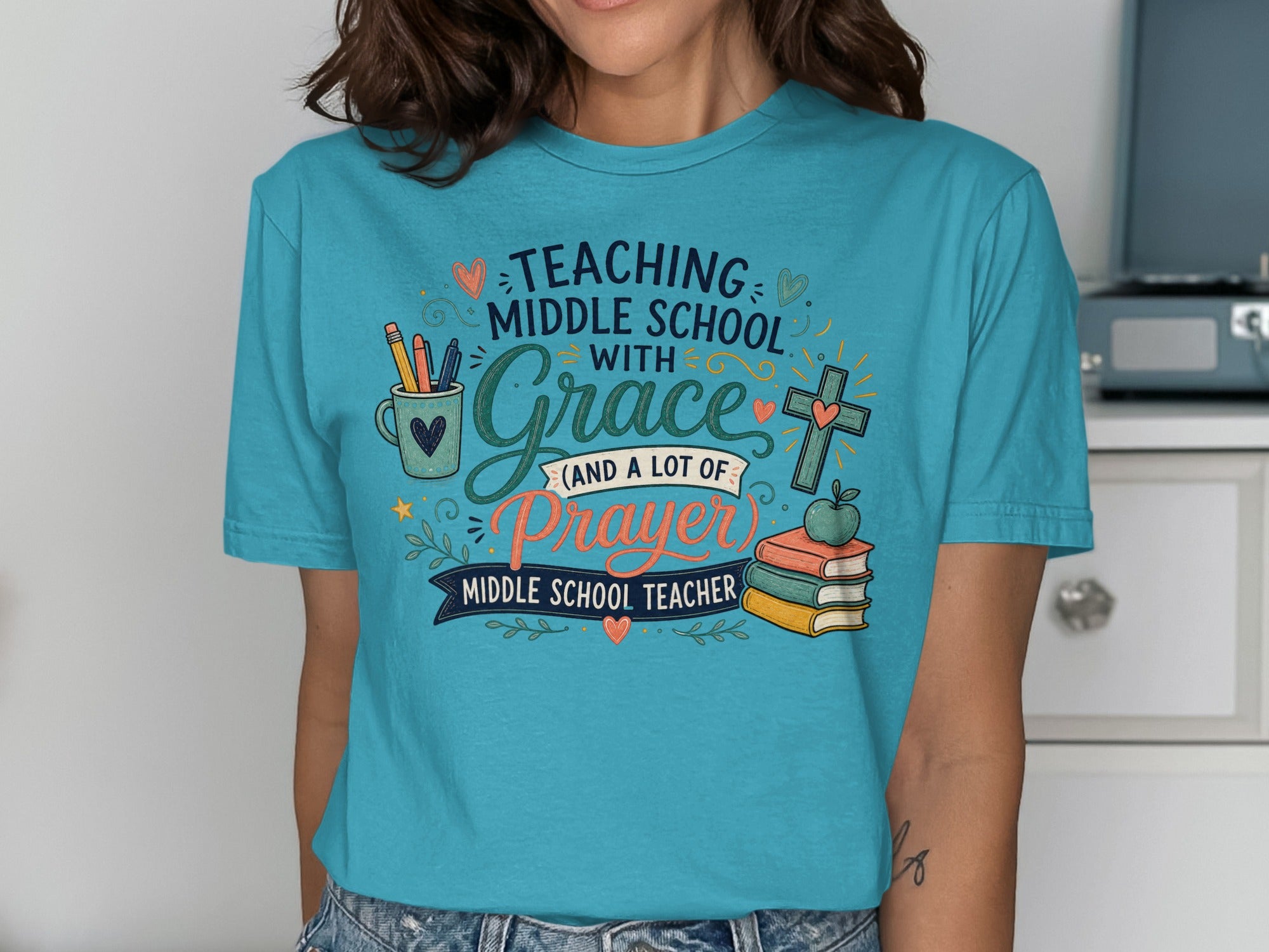 Teal t-shirt with "Teaching Middle School with Grace and a Lot of Prayer" text.