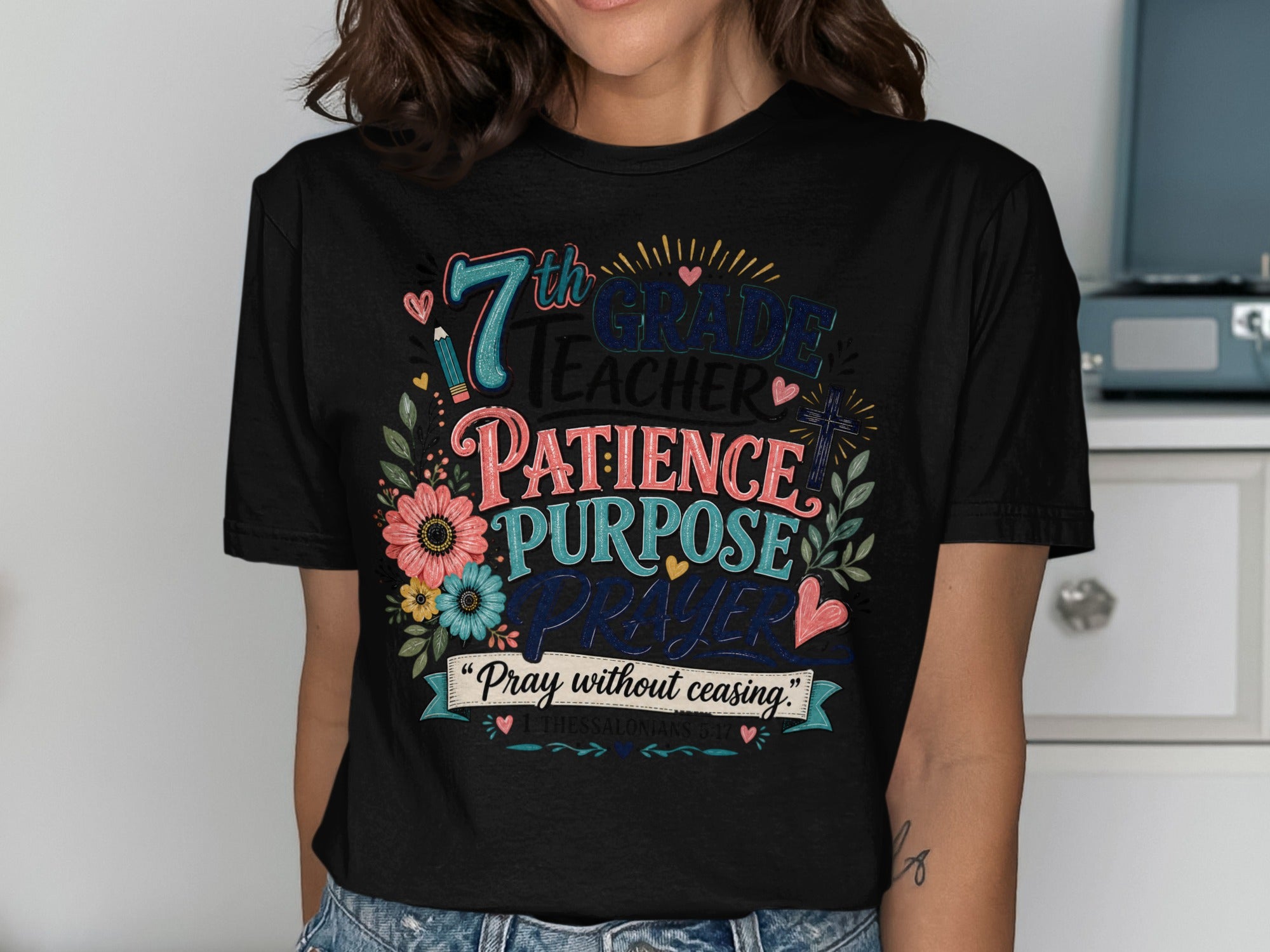 Black t-shirt with "7th Grade Teacher" text and floral accents.