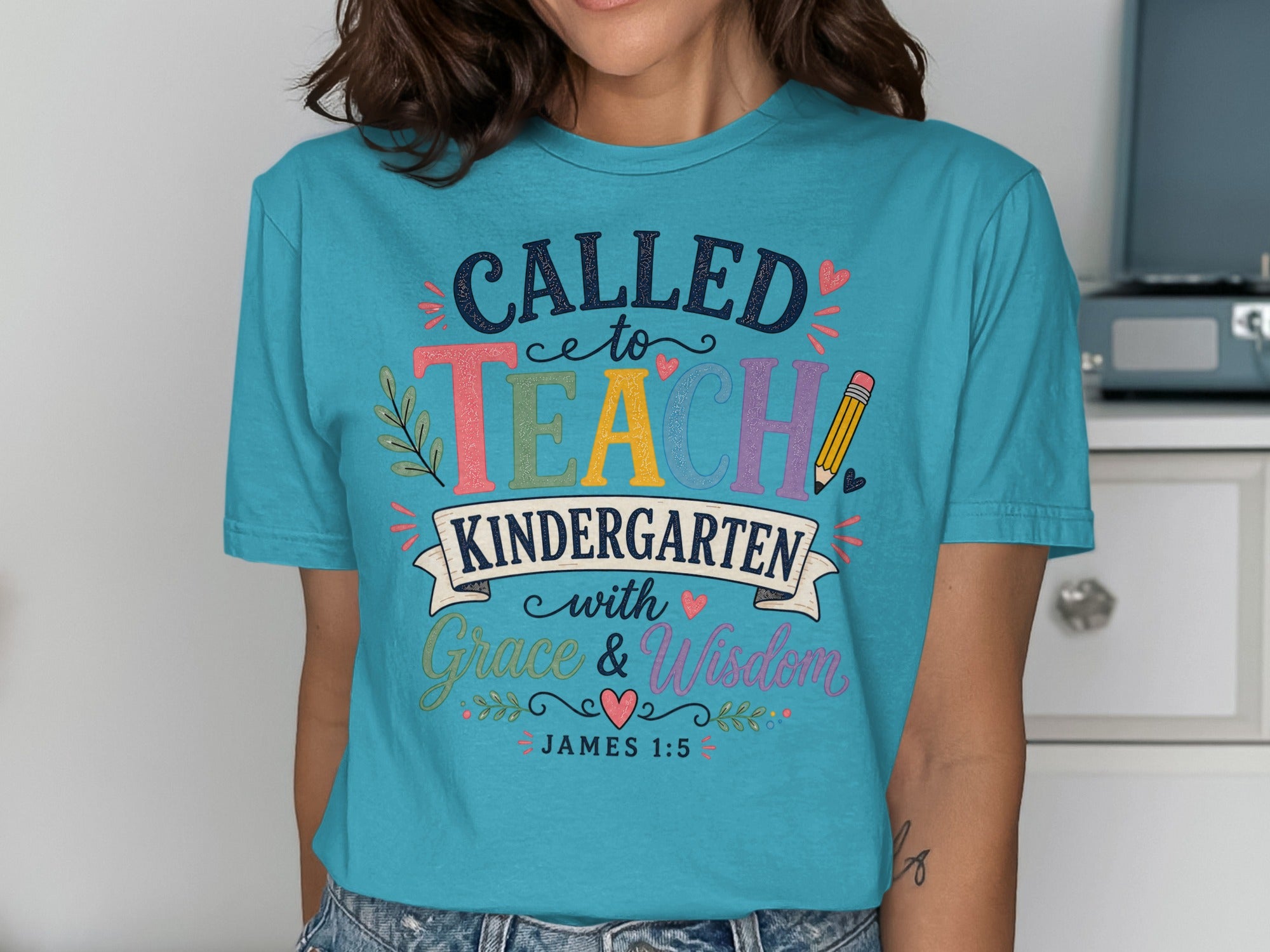 "CALLED to TEACH KINDERGARTEN with Grace & Wisdom" text on a blue t-shirt.