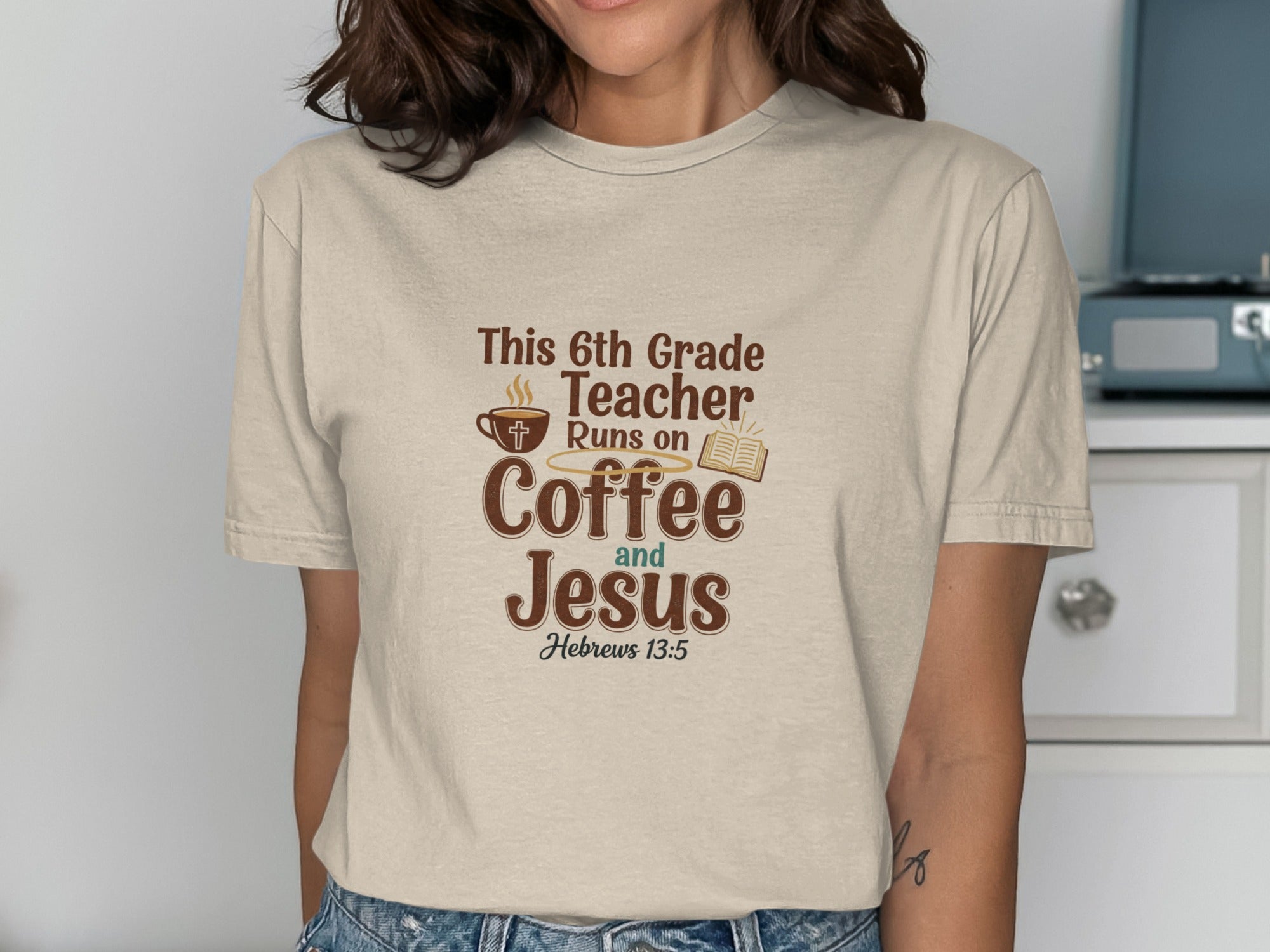 T-shirt with text "This 6th Grade Teacher Runs on Coffee and Jesus Hebrews 13:5".