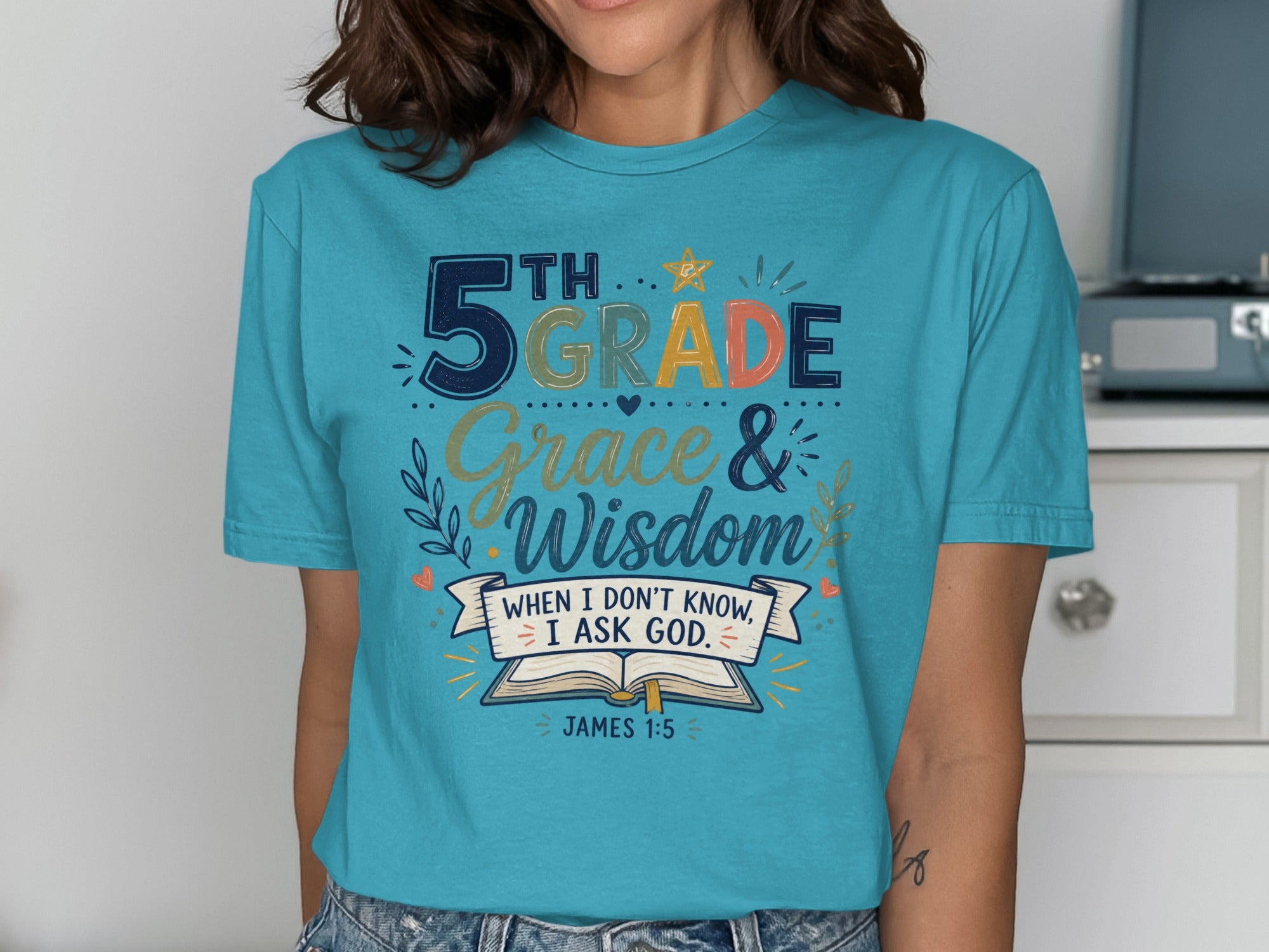 Teal t-shirt with "5th Grade Grace & Wisdom" and James 1:5 Bible verse.