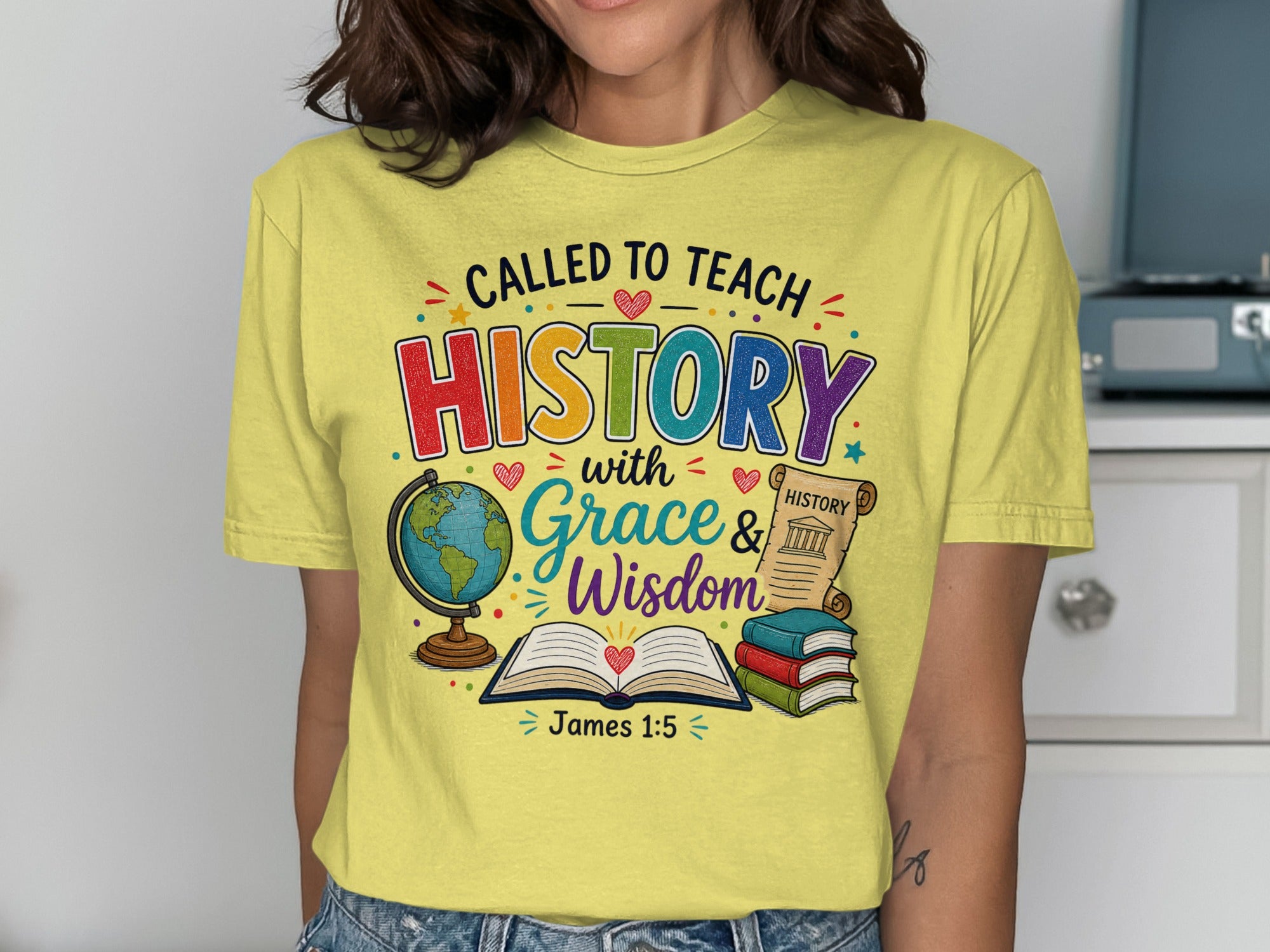 Yellow t-shirt with "Called to Teach History with Grace & Wisdom" and James 1:5.
