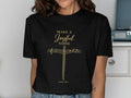 Black t-shirt with gold musical notes forming a cross and "Make a Joyful Noise" text.