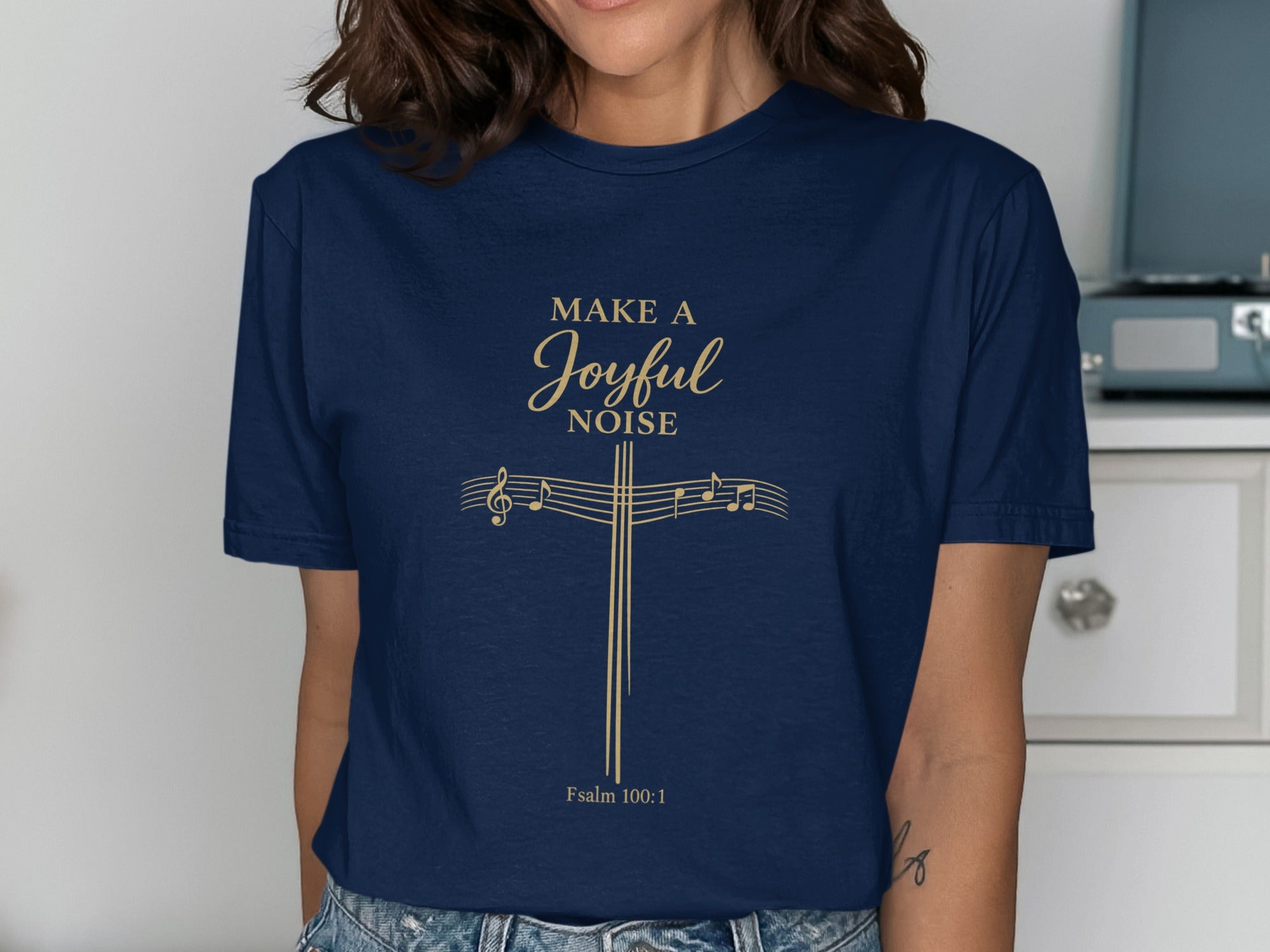 Navy t-shirt with "MAKE A JOYFUL NOISE" and musical notes, Psalm 100:1.