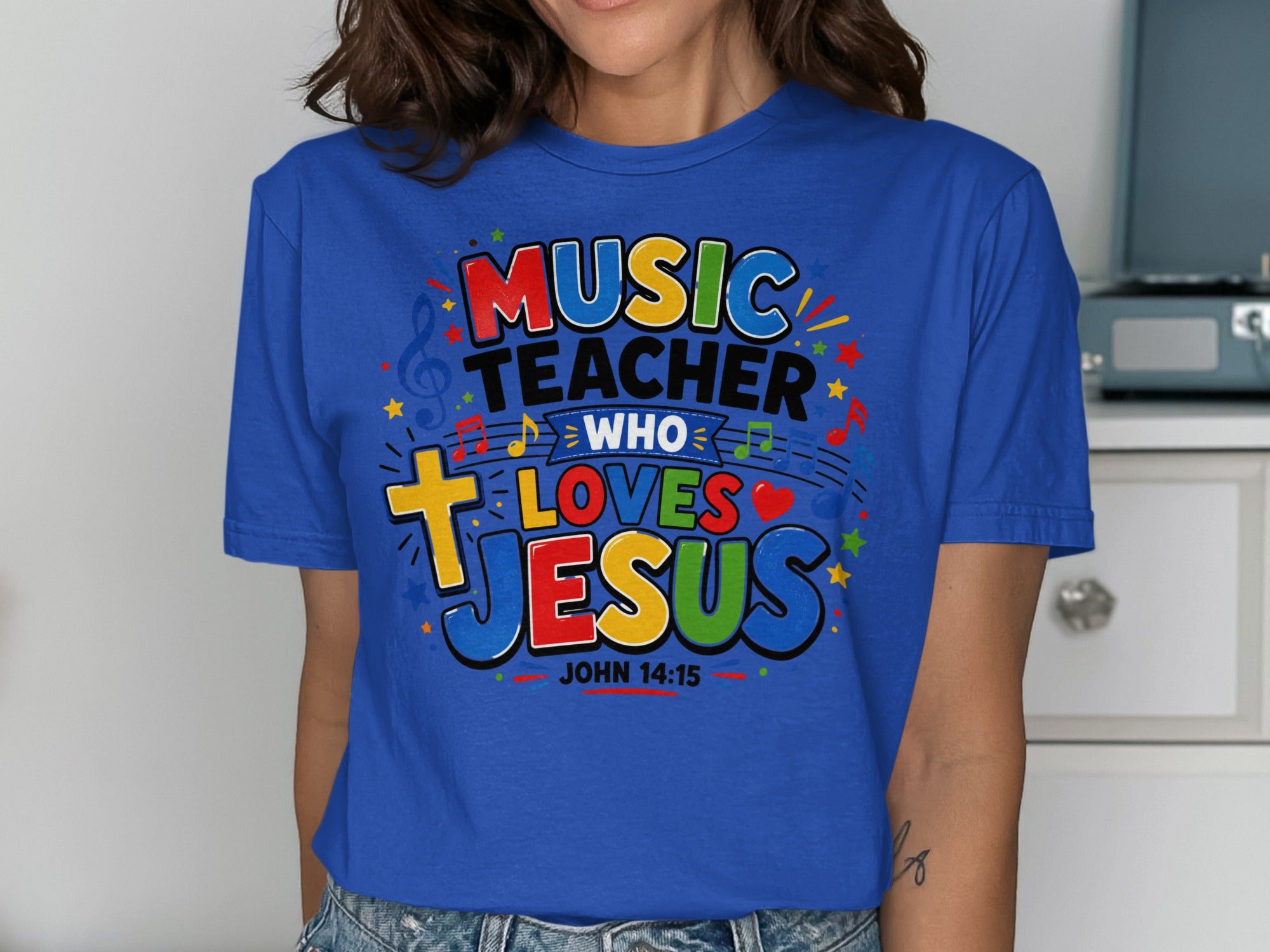 Blue t-shirt with "Music Teacher Who Loves Jesus" and John 14:15.