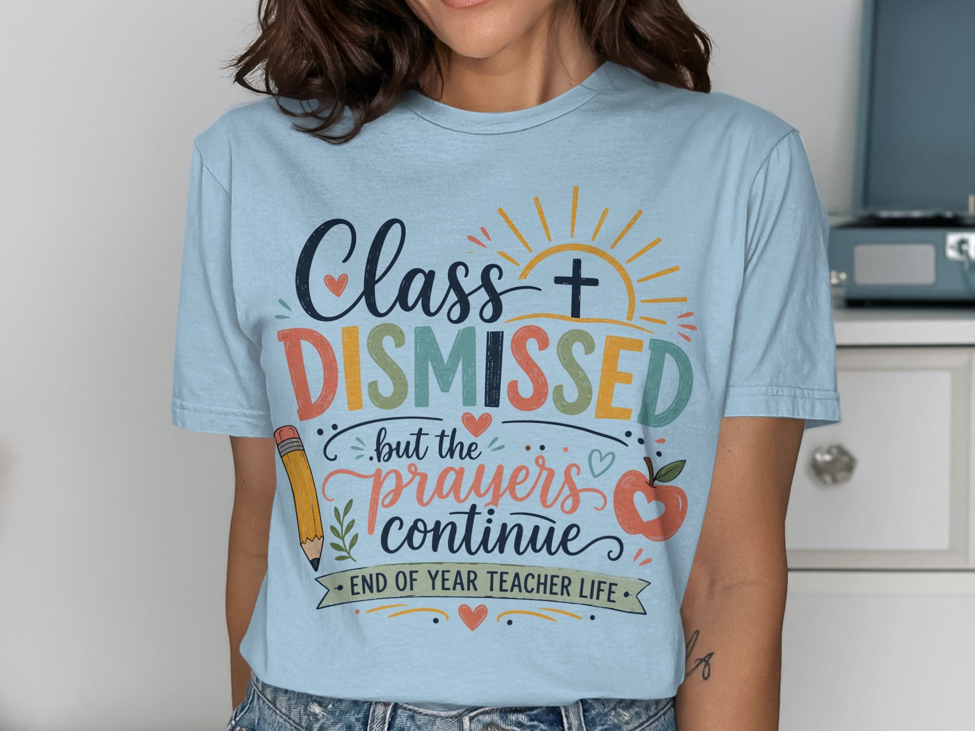 "Class Dismissed but the prayers continue" t-shirt with apple and pencil graphics.