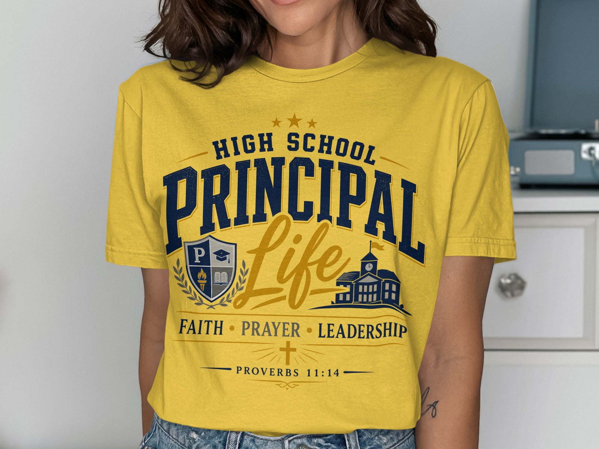 Yellow t-shirt with "High School Principal Life" and shield graphic.