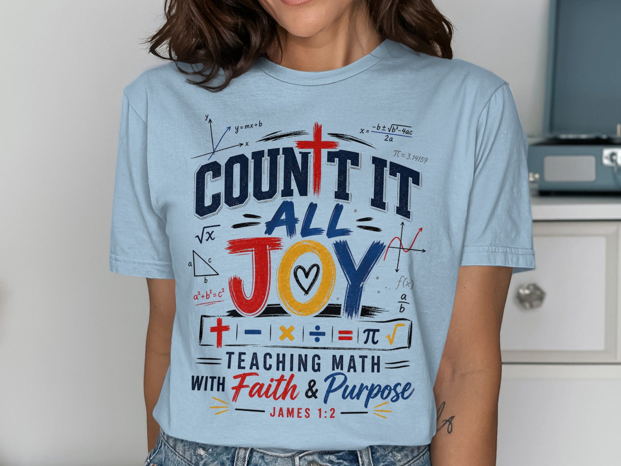 Light blue t-shirt with "COUNT IT ALL JOY TEACHING MATH WITH Faith & Purpose" and math symbols.
