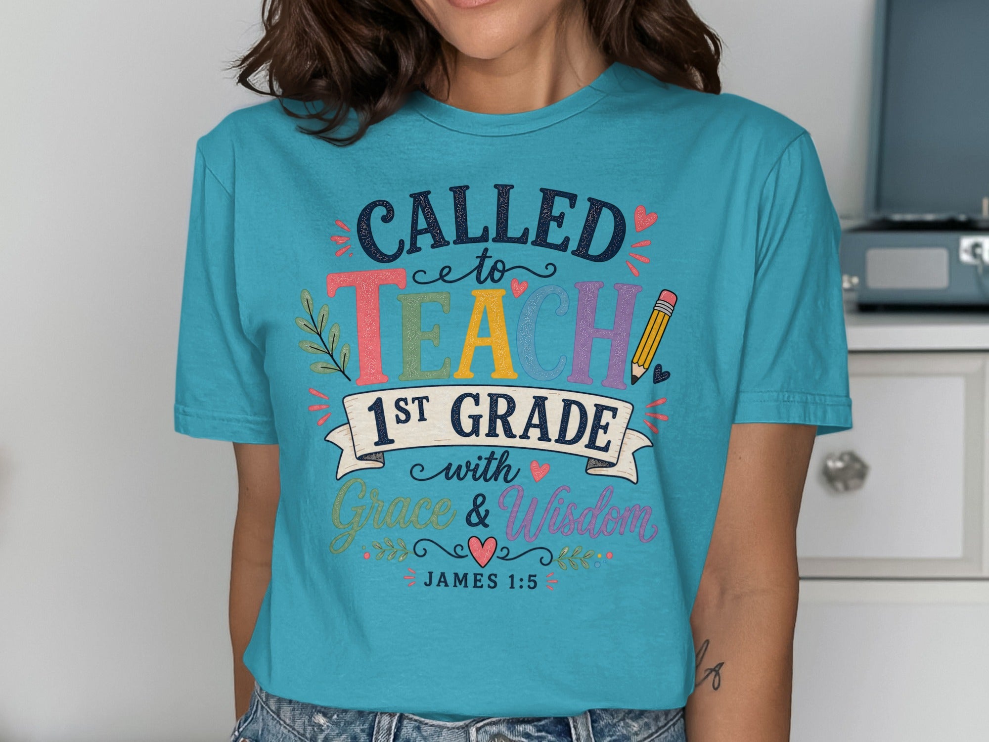 Teal t-shirt with "Called to Teach 1st Grade with Grace & Wisdom" text.