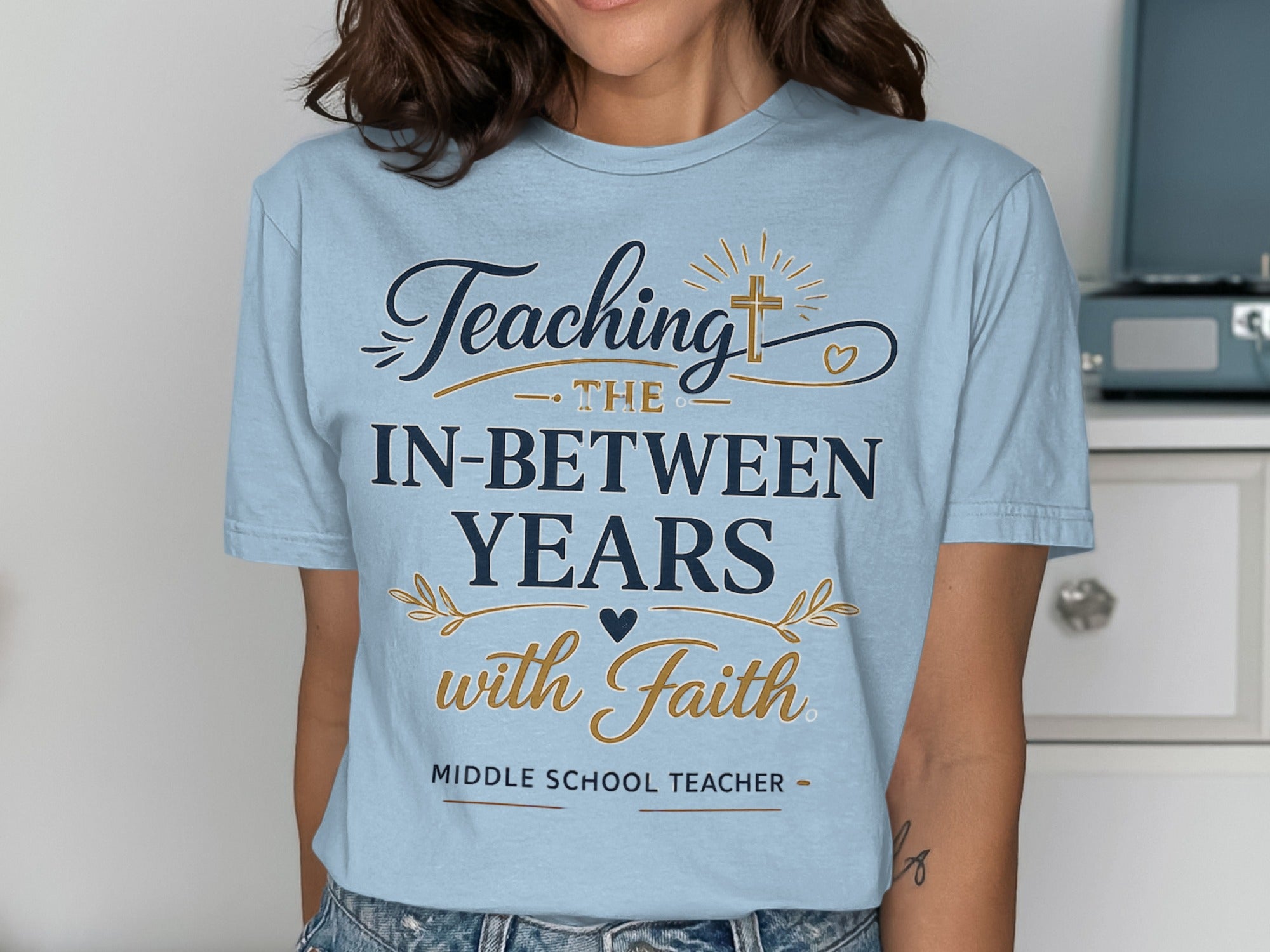 T-shirt with "Teaching The In-Between Years with Faith, Middle School Teacher" text.