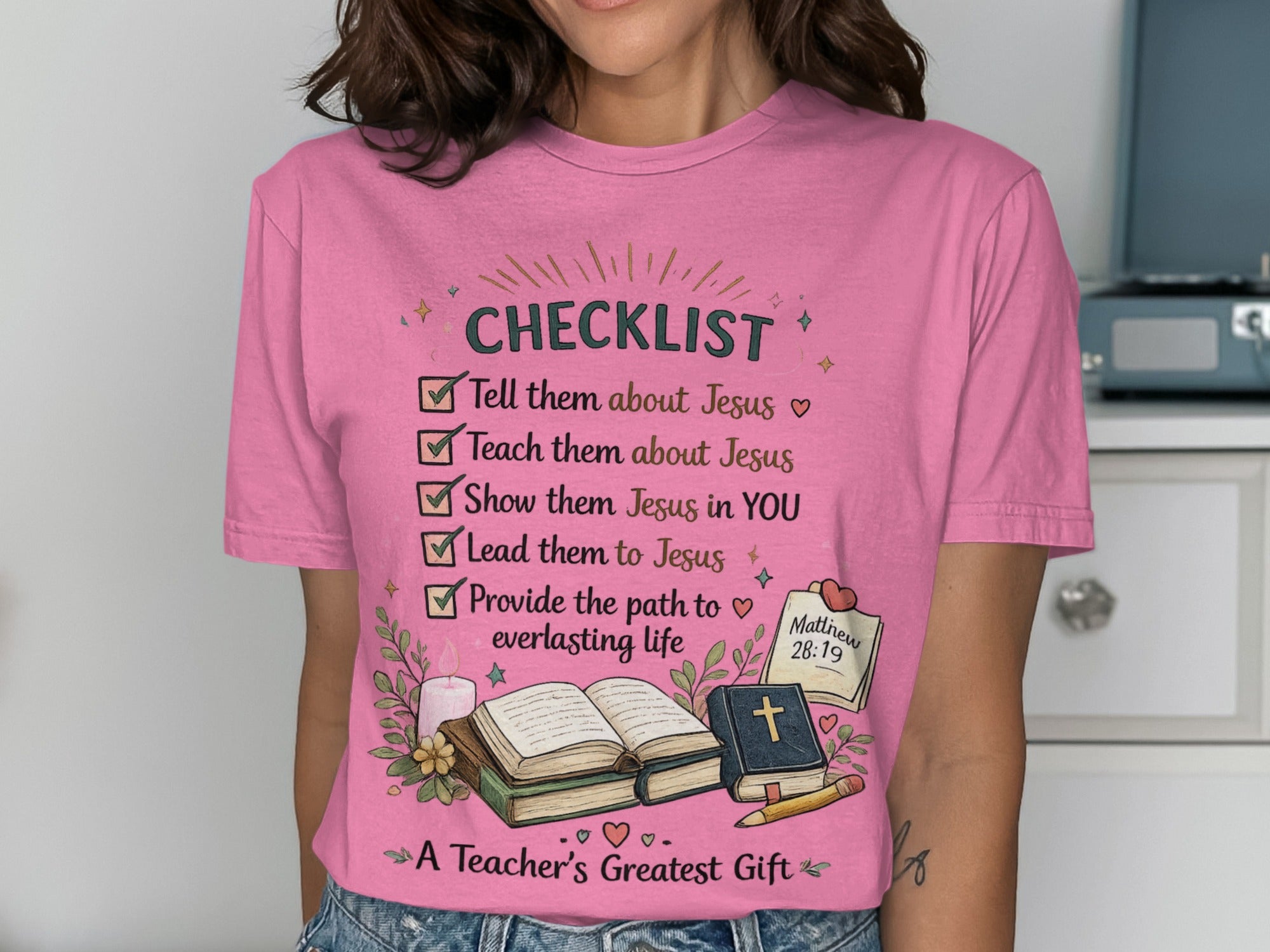 Pink t-shirt with "CHECKLIST" and Bible verses related to teaching Jesus.