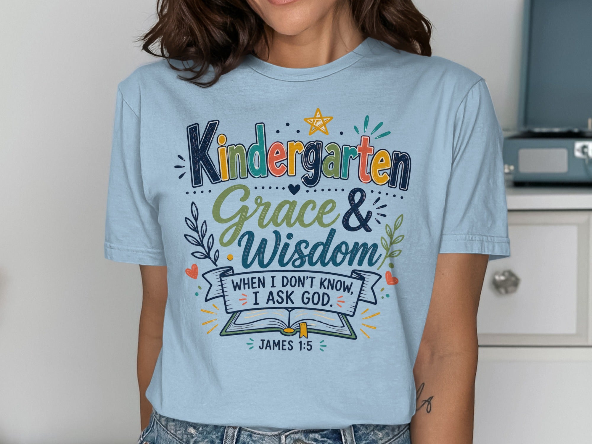 Light blue t-shirt with "Kindergarten Grace & Wisdom When I don't know, I ask God."