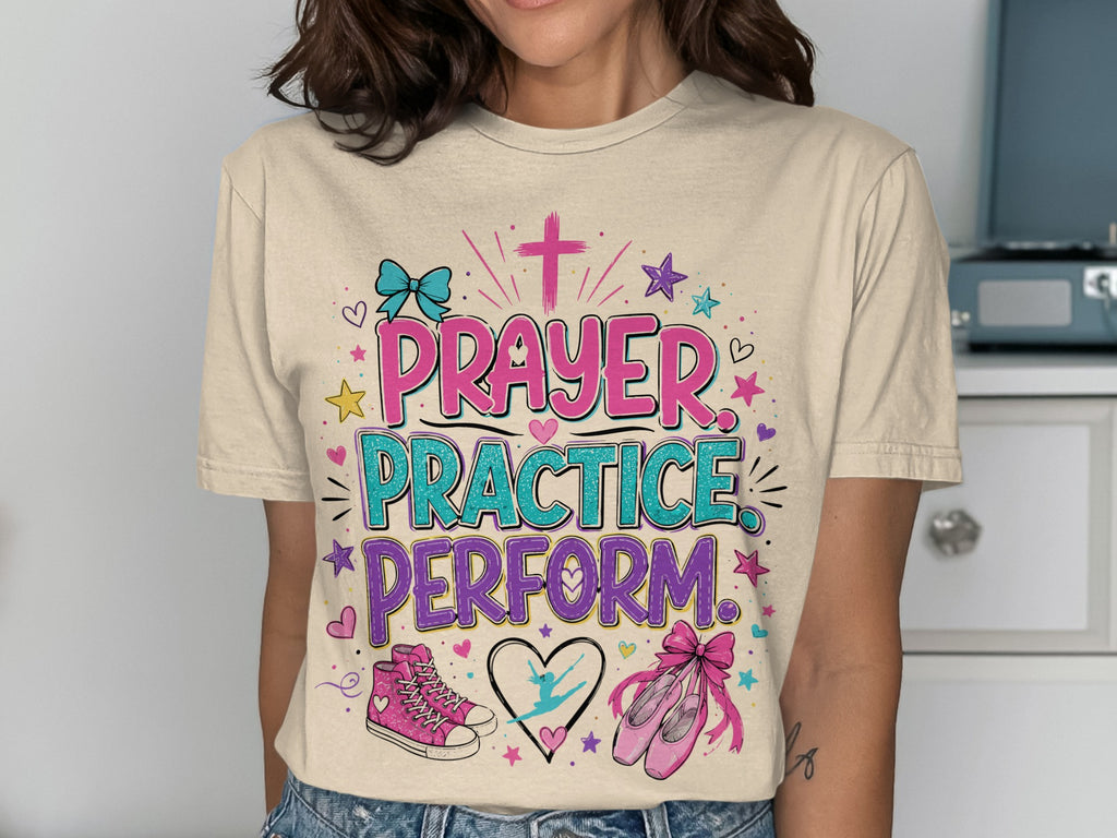 T-shirt with "Prayer Practice Perform" text and ballet shoes.