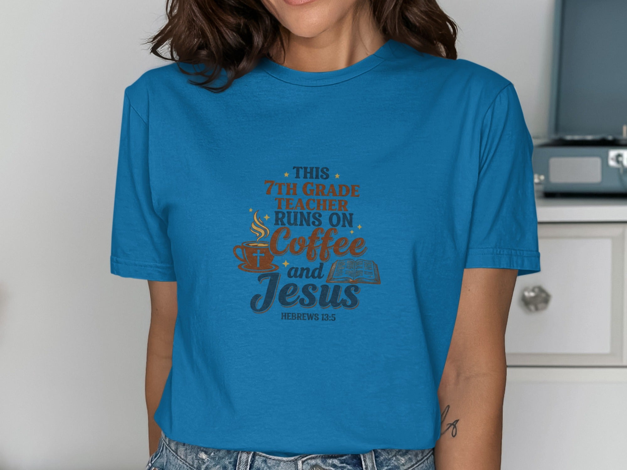 Blue t-shirt with "This 7th Grade Teacher Runs On Coffee and Jesus" text.