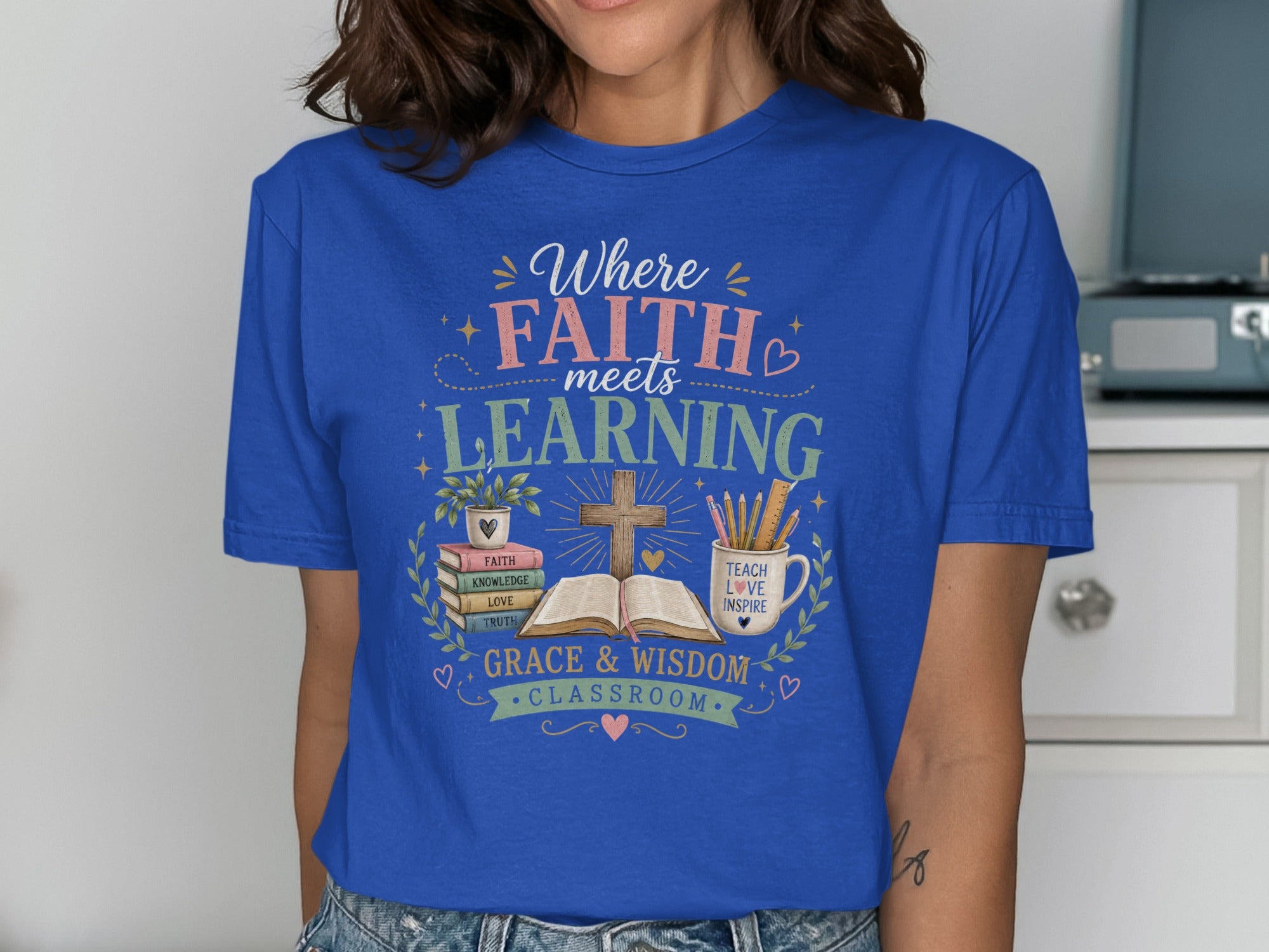 Blue t-shirt with "Where FAITH meets LEARNING" and "GRACE & WISDOM CLASSROOM" text.