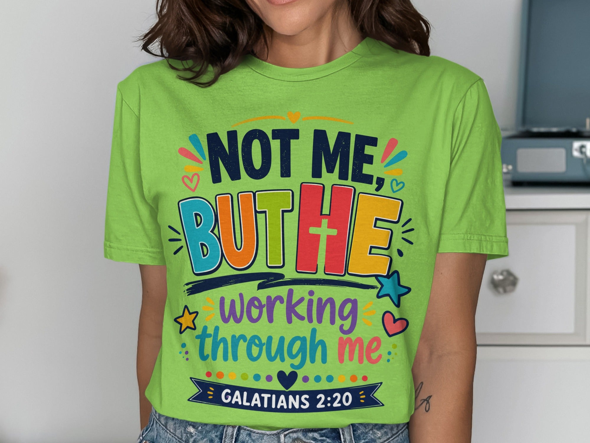 Lime green t-shirt with "Not me, but He working through me" and Galatians 2:20.