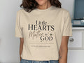 Beige t-shirt with "Little Hearts Matter to God" text.