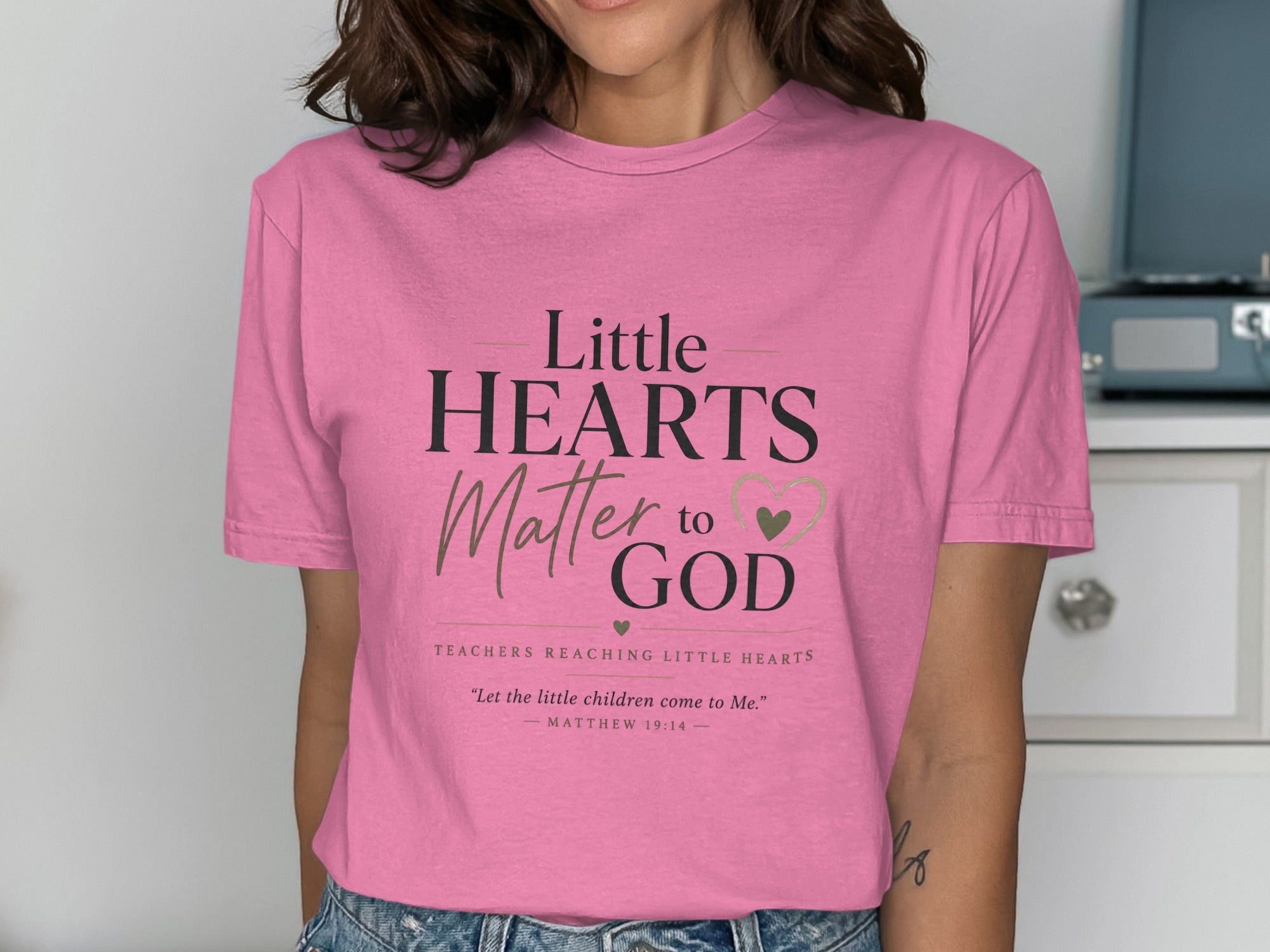 Pink t-shirt with "Little Hearts Matter to God" and Bible verse.