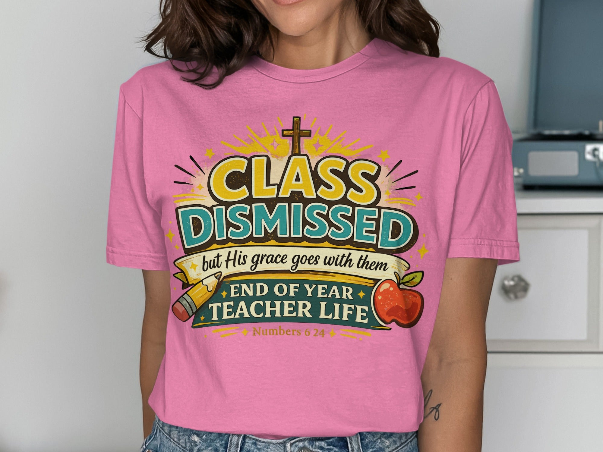 Pink t-shirt with "Class Dismissed but His grace goes with them" graphic.