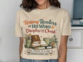 T-shirt with "Raising Readers of His Word & Disciples for Christ" text, books, and cross.