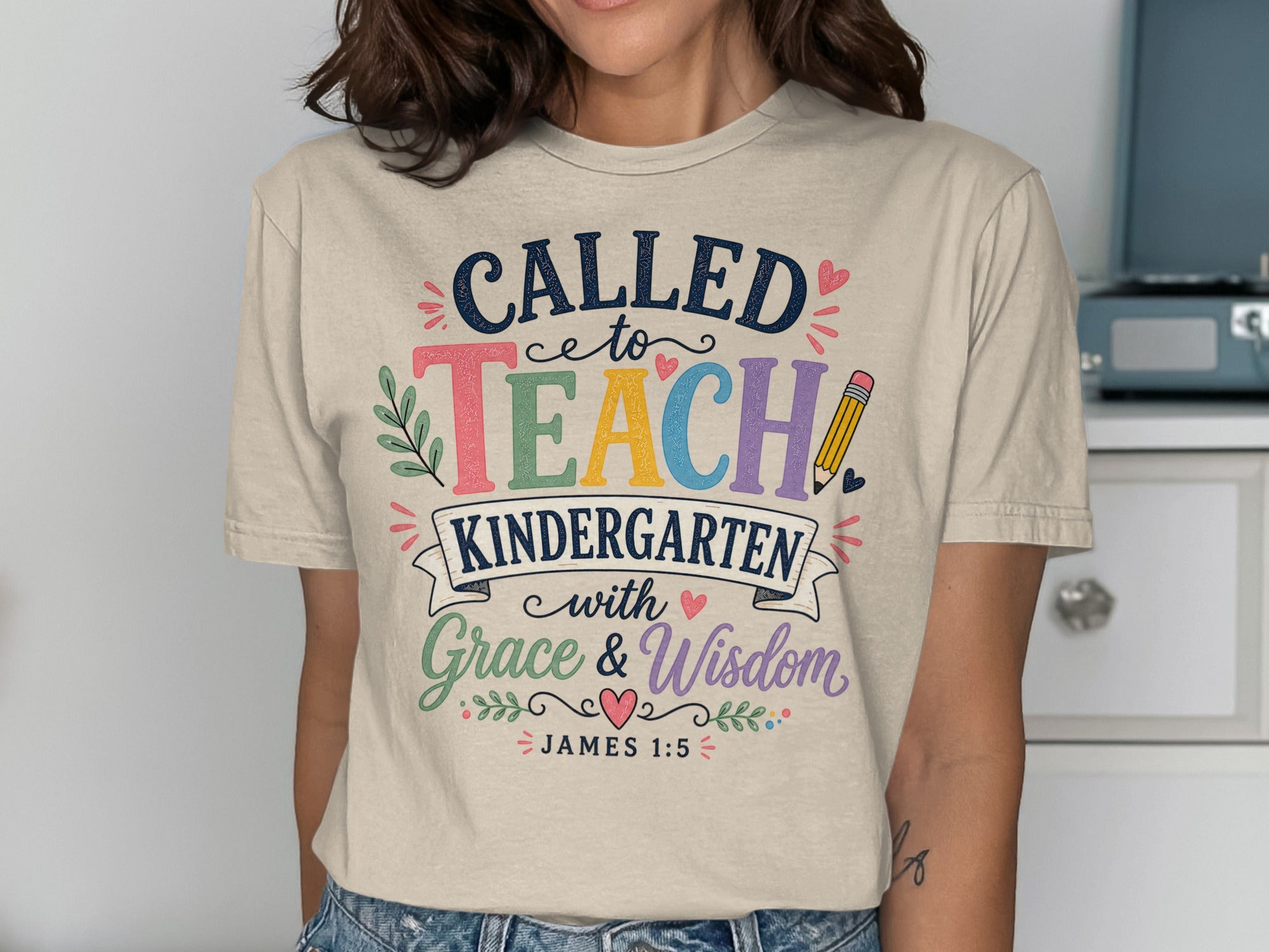 "CALLED to TEACH KINDERGARTEN with Grace & Wisdom" text on a t-shirt.