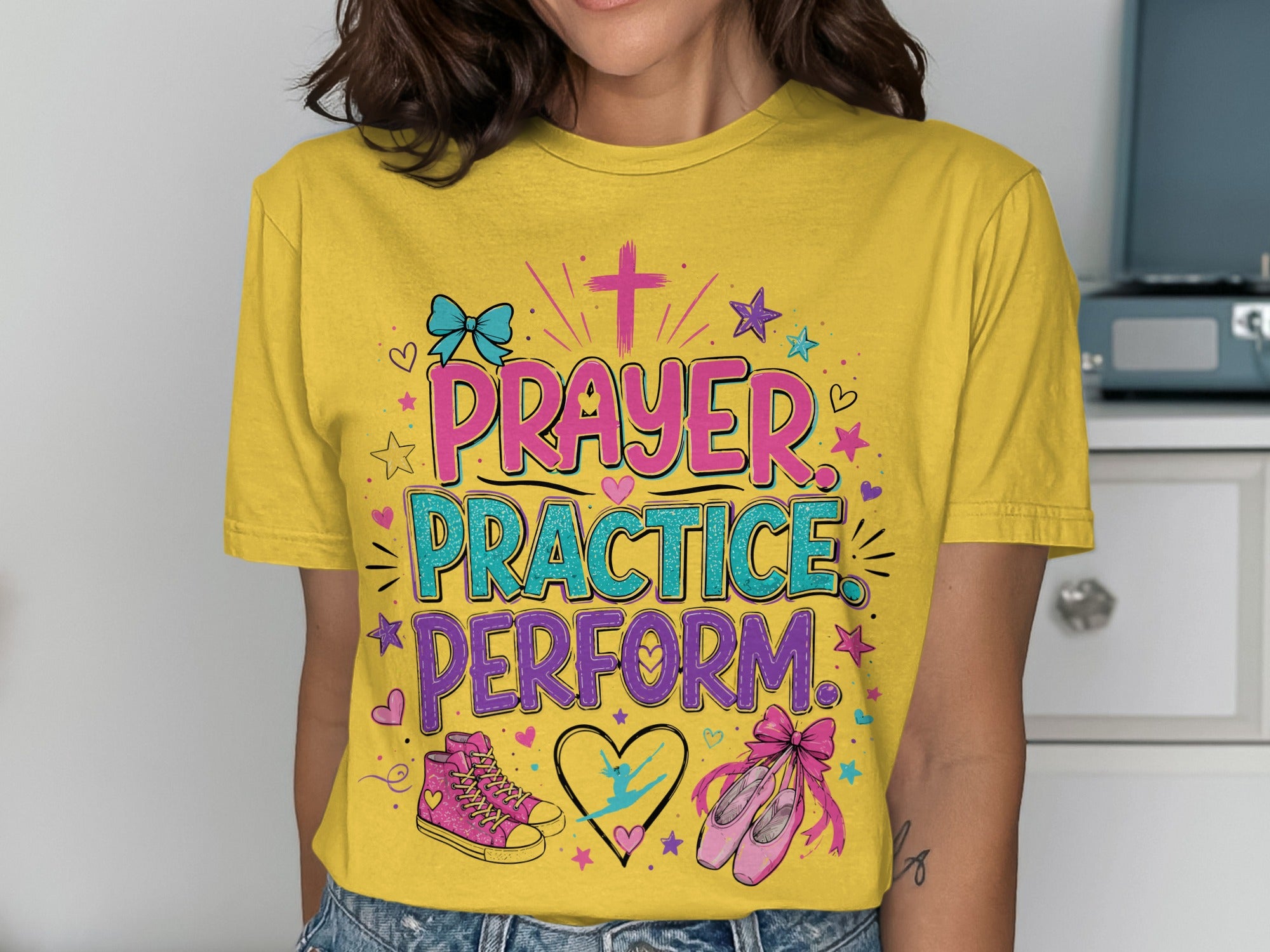 Yellow t-shirt with "Prayer Practice Perform" text and ballet elements.