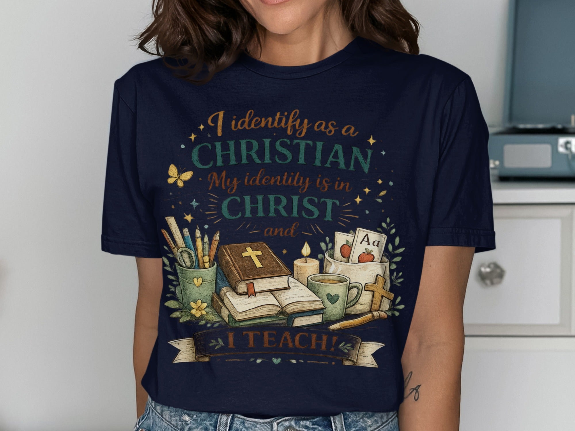 Dark blue t-shirt with text "I identify as a CHRISTIAN My identity is in CHRIST and I TEACH!".