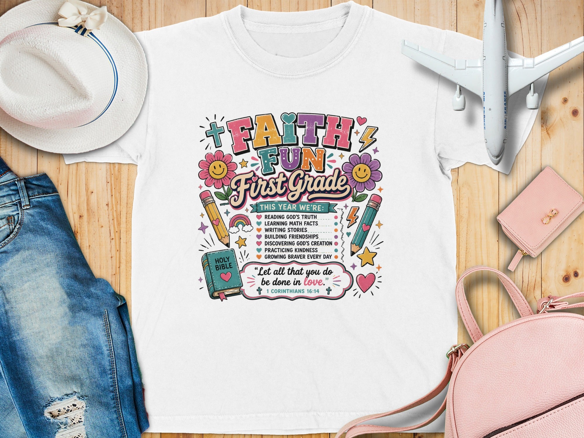 T-shirt with "Faith Fun First Grade" text and school-themed graphics.