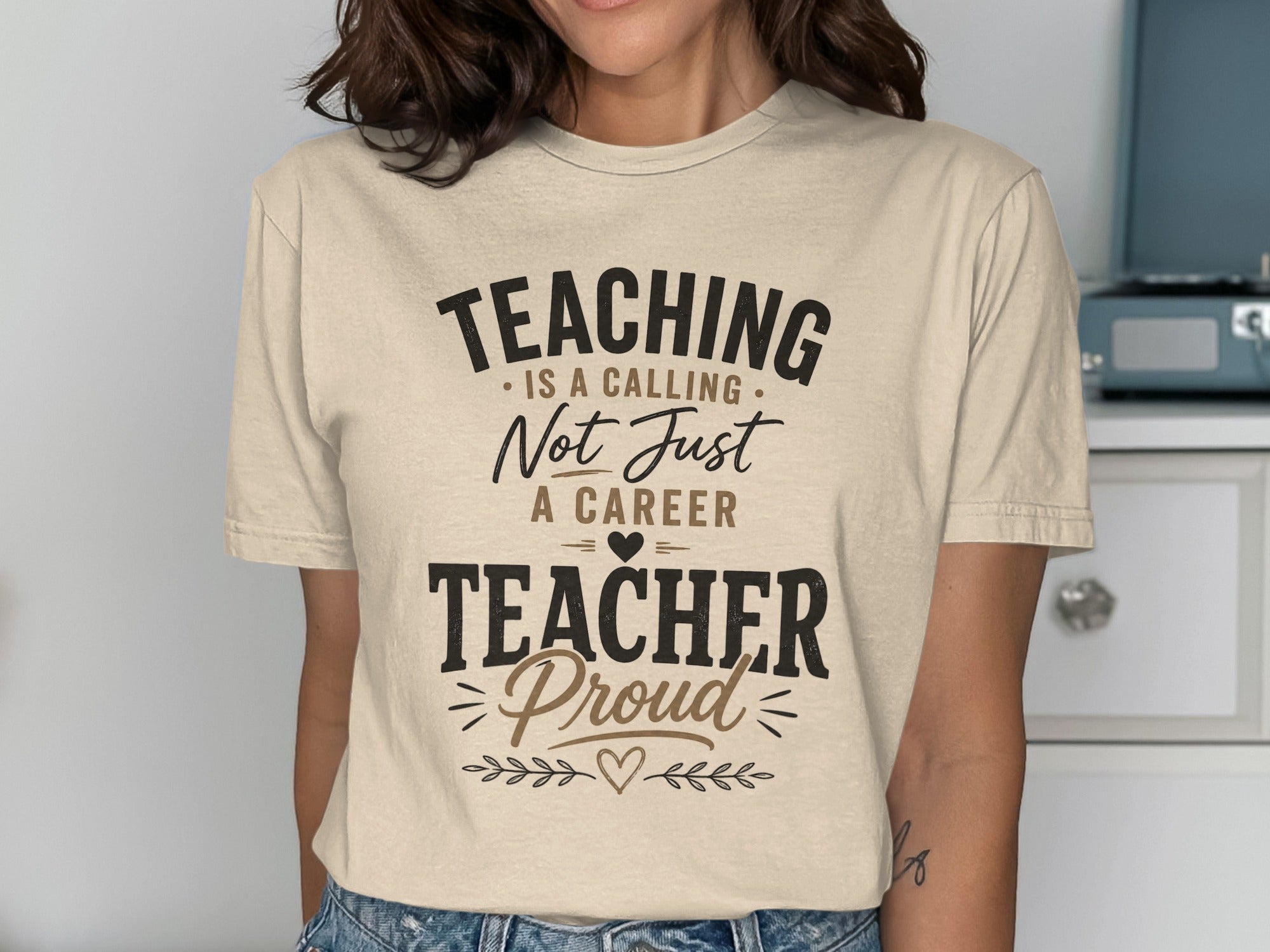 T-shirt with text "Teaching is a calling, not just a career. Teacher proud."