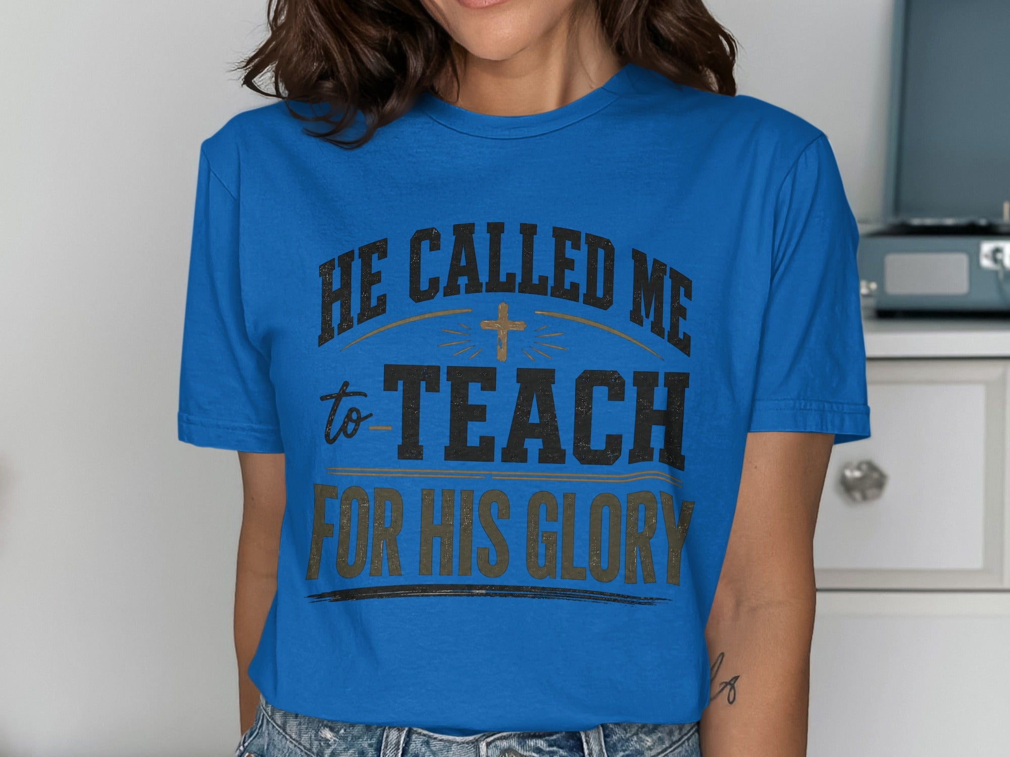 Blue t-shirt with "HE CALLED ME to TEACH FOR HIS GLORY" text.
